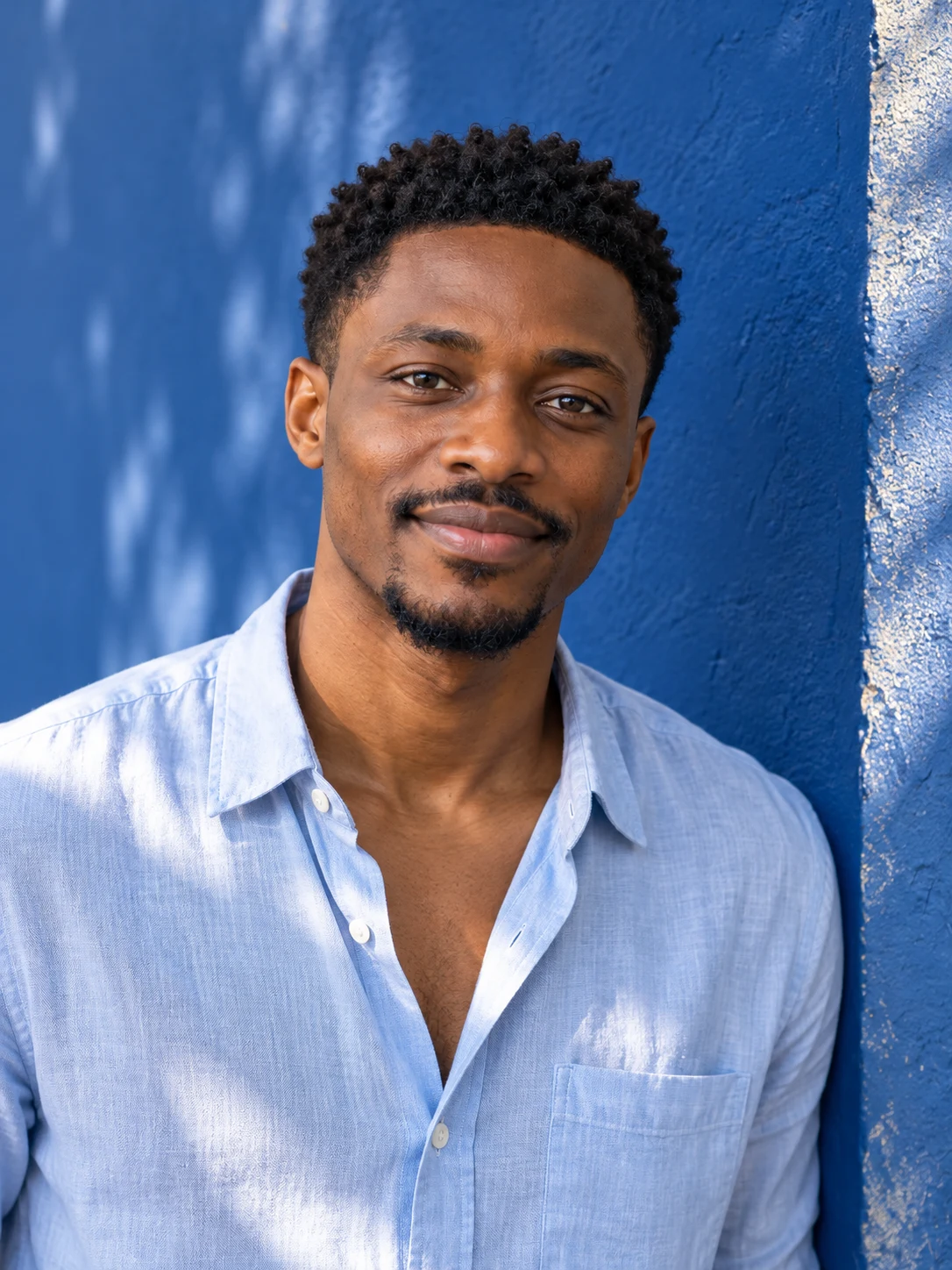 Tunde, 28, a fictional adult AI character.